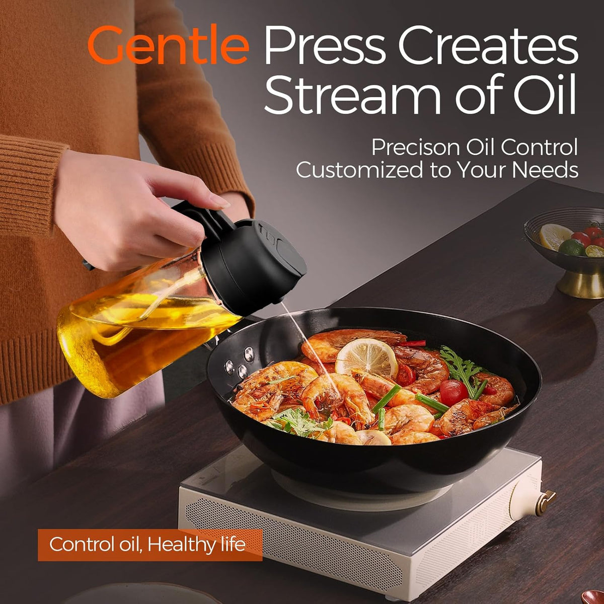 A gentle press pours a controlled stream of oil into a hot pan